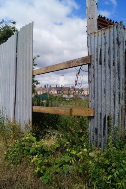 bentinck docks grain silo visible through fence at rope walk